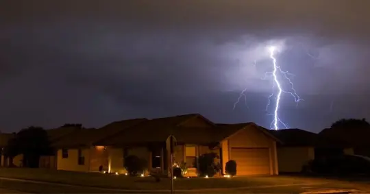 Lightening strikes over a residential area