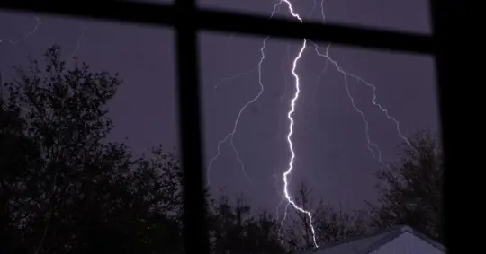 Lightning Bolt Viewed Through A Window